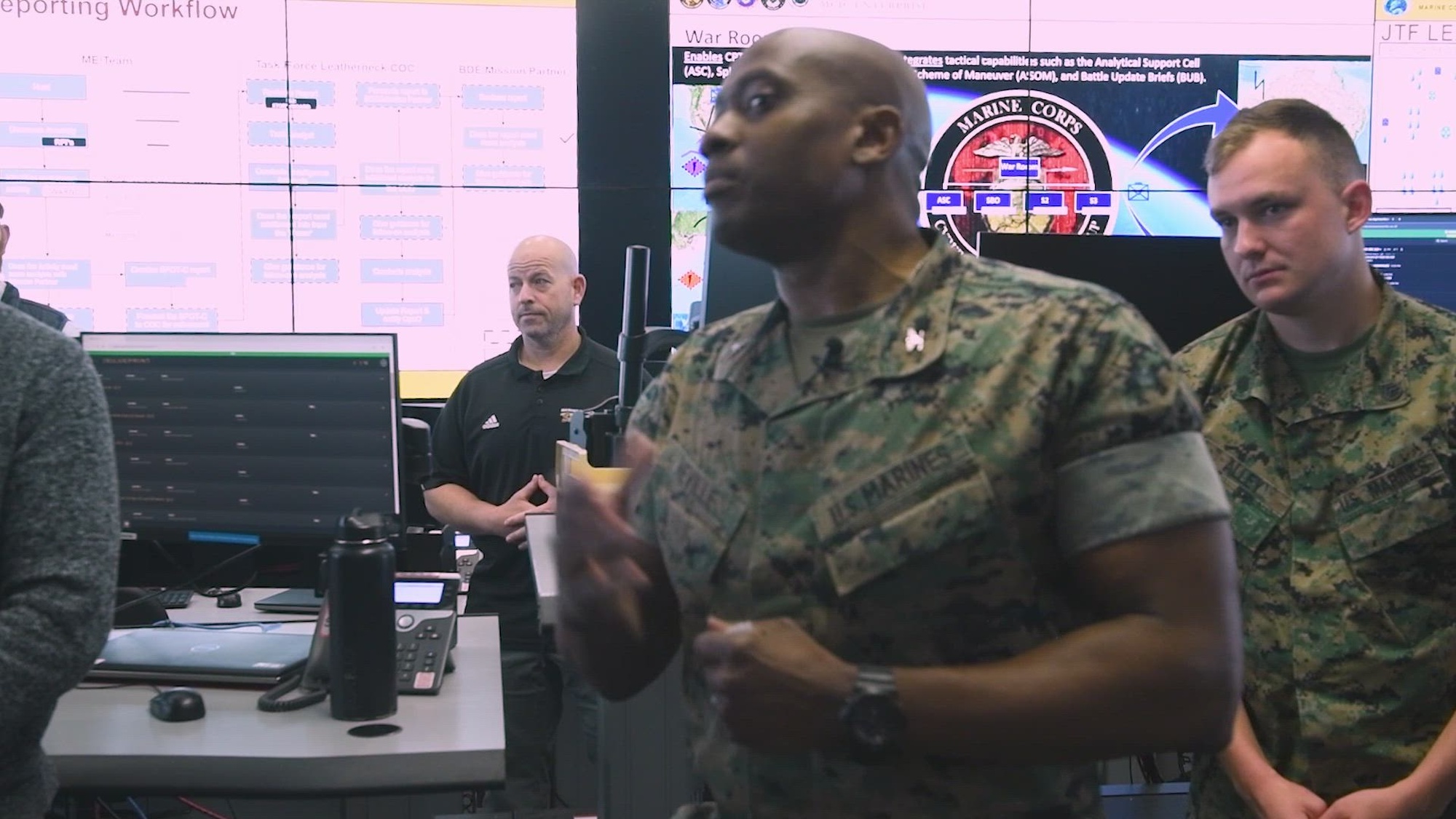 U.S. Marines with Marine Corps Cyber Warfare Group attend the opening of the MCCYWG War Room at an undisclosed location, March 27, 2025. The war room enables Cyber Protection Team functions at distance and integrates tactical capabilities such as the Analytical Support Cell, Split Based Operations, Analytical Scheme of Maneuver, and Battle Update Briefs. (U.S. Marine Corps video by Lance Cpl. Steven Wells)