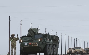 U.S. Soldiers offload and relocate approximately 50 M1126 Stryker armored vehicles