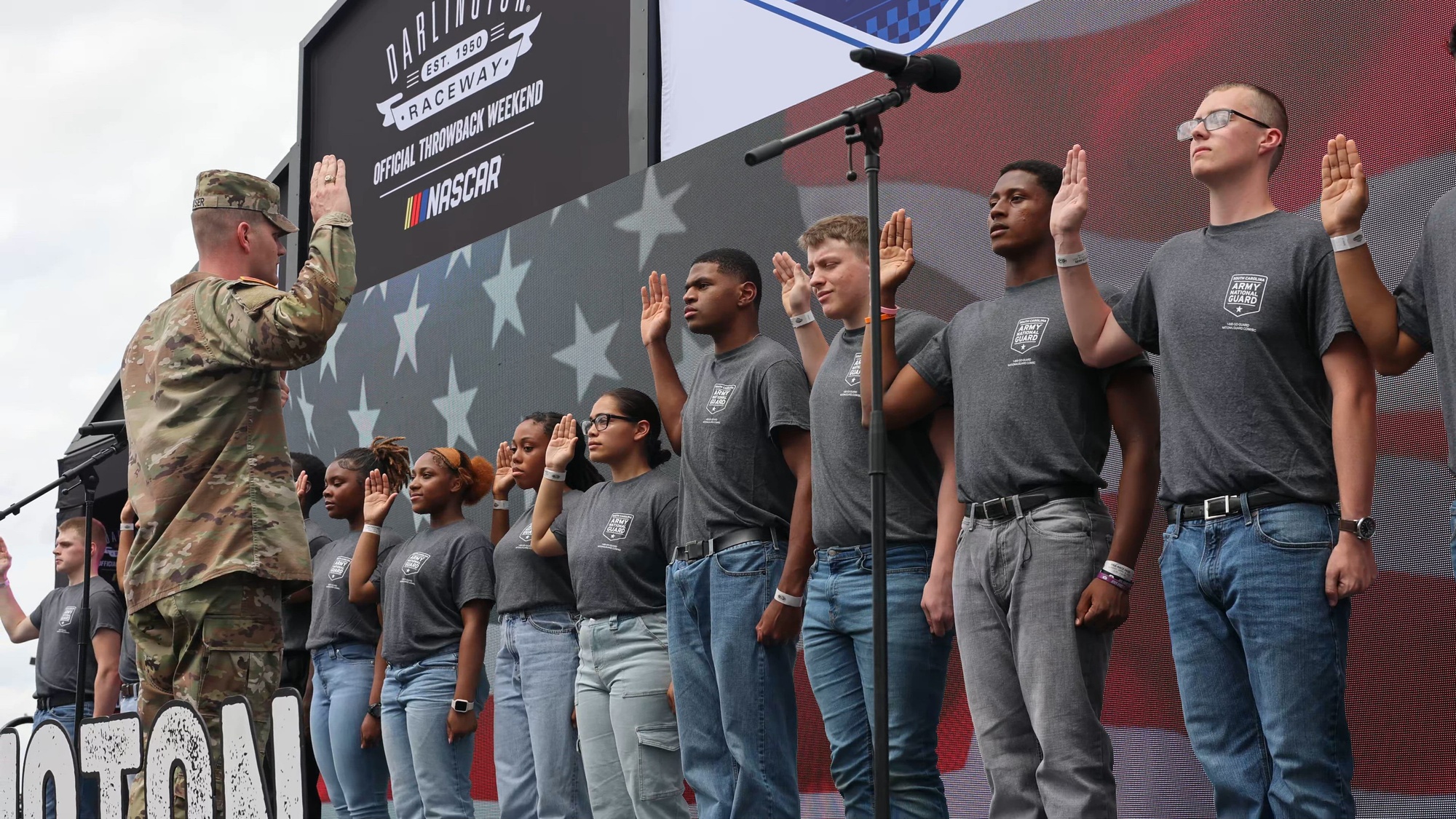 Fifteen South Carolina Army National Guard Recruiting Sustainment Program members were sworn into the Army National Guard during a NASCAR pre-race enlistment ceremony on the infield of historic Darlington Raceway in Darlington, South Carolina, April 6, 2025. The oath of enlistment was administered by U.S. Army Maj. Matthew Moser, commander of Bravo Company, Recruiting and Retention Battalion, South Carolina Army National Guard. U.S. Army Maj. Gen. Jeff Jones, deputy adjutant general of South Carolina, was also in attendance. The pre-race ceremony was hosted by Darlington Raceway to formally recognize and welcome the newest members of the South Carolina Army National Guard as they begin their military journey.