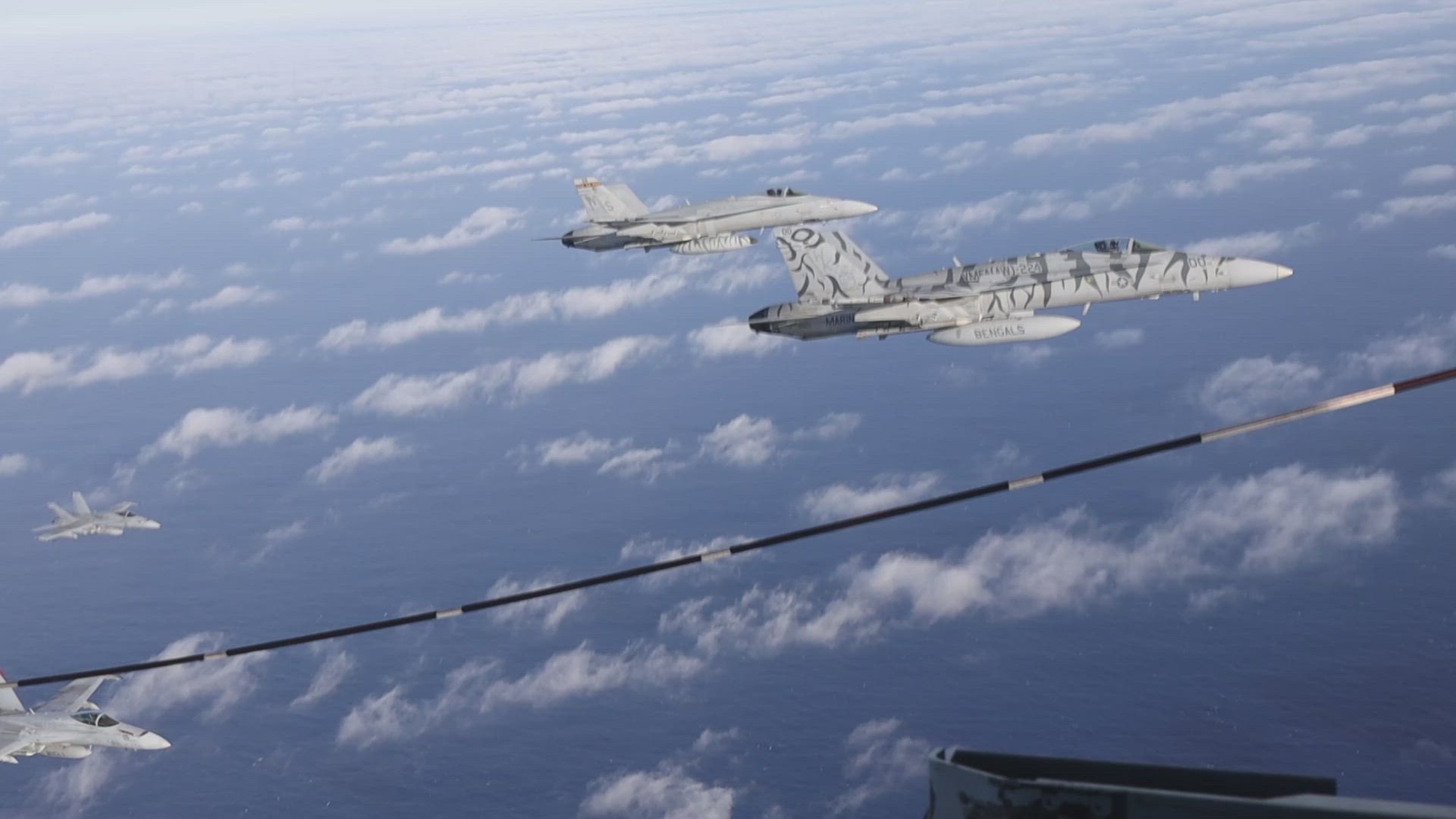 A U.S. Marine Corps F/A-18 Hornets pilot assigned to Marine Aviation Weapons and Tactics Squadron One (MAWTS-1) participate in an aerial refuel exercise as part of Weapons and Tactics Instructor course 2-25 off the coast of California, April 10, 2025. WTI is a seven-week training event hosted by MAWTS-1 which emphasizes operational integration of the six functions of Marine aviation in support of the Marine Air Ground Task Force, Joint and Coalition Forces. (U.S. Marine Corps video by Lance Cpl. Adam Scalin)