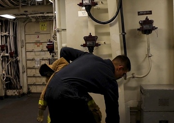 Sailors Onboard USS Iwo Jima Participate in a Main Space Fire Drill