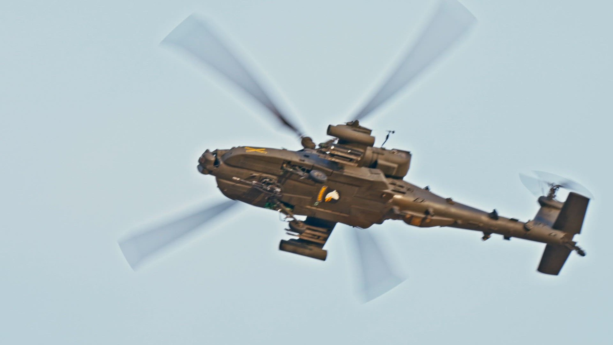 An AH64 Apache assigned to the 101st Combat Aviation Brigade, 101st Airborne Division provides security for the Downed Aircraft Recovery Team (DART) during a simulated recovery operation on a downed UH-60 Blackhawk on April 2, 2025. DART teams are responsible for recovering aircraft after they crash or become disabled and can no longer fly. (U.S. Army video by Staff Sgt. Vincent Levelev)