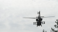B-Roll; U.S. Army AH-64 Apaches roar through Latvia demonstrating lethality