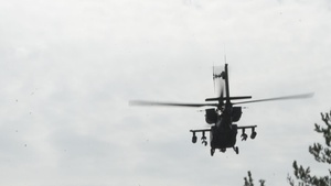 B-Roll; U.S. Army AH-64 Apaches roar through Latvia demonstrating lethality