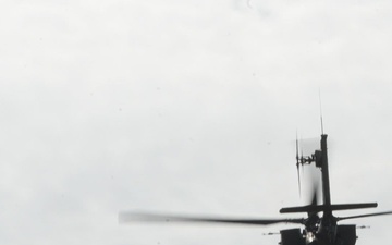 B-Roll; U.S. Army AH-64 Apaches roar through Latvia demonstrating lethality