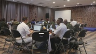 Participants of the Exercise Control Group Conduct a Simulated Scenario Exercise During Obangame Express 2025