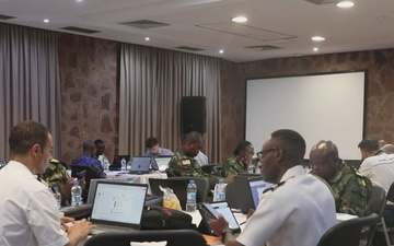 Participants of the Exercise Control Group Conduct a Simulated Scenario Exercise During Obangame Express 2025