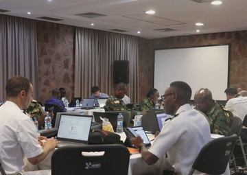 Participants of the Exercise Control Group Conduct a Simulated Scenario Exercise During Obangame Express 2025