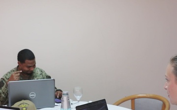 Participants of the Exercise Control Group Conduct a Simulated Scenario Exercise During Obangame Express 2025