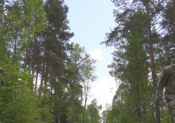Competitors complete ruck march during V Corps Best Squad Competition