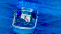 U.S. Navy HSC-25 hoists Lucky Harvest mariner