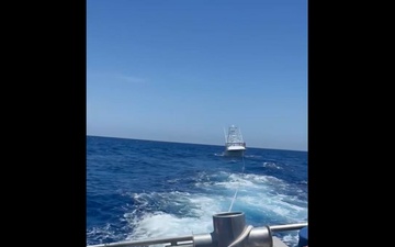 U.S. Coast Guard Station Canaveral boat crew members assist disabled vessel