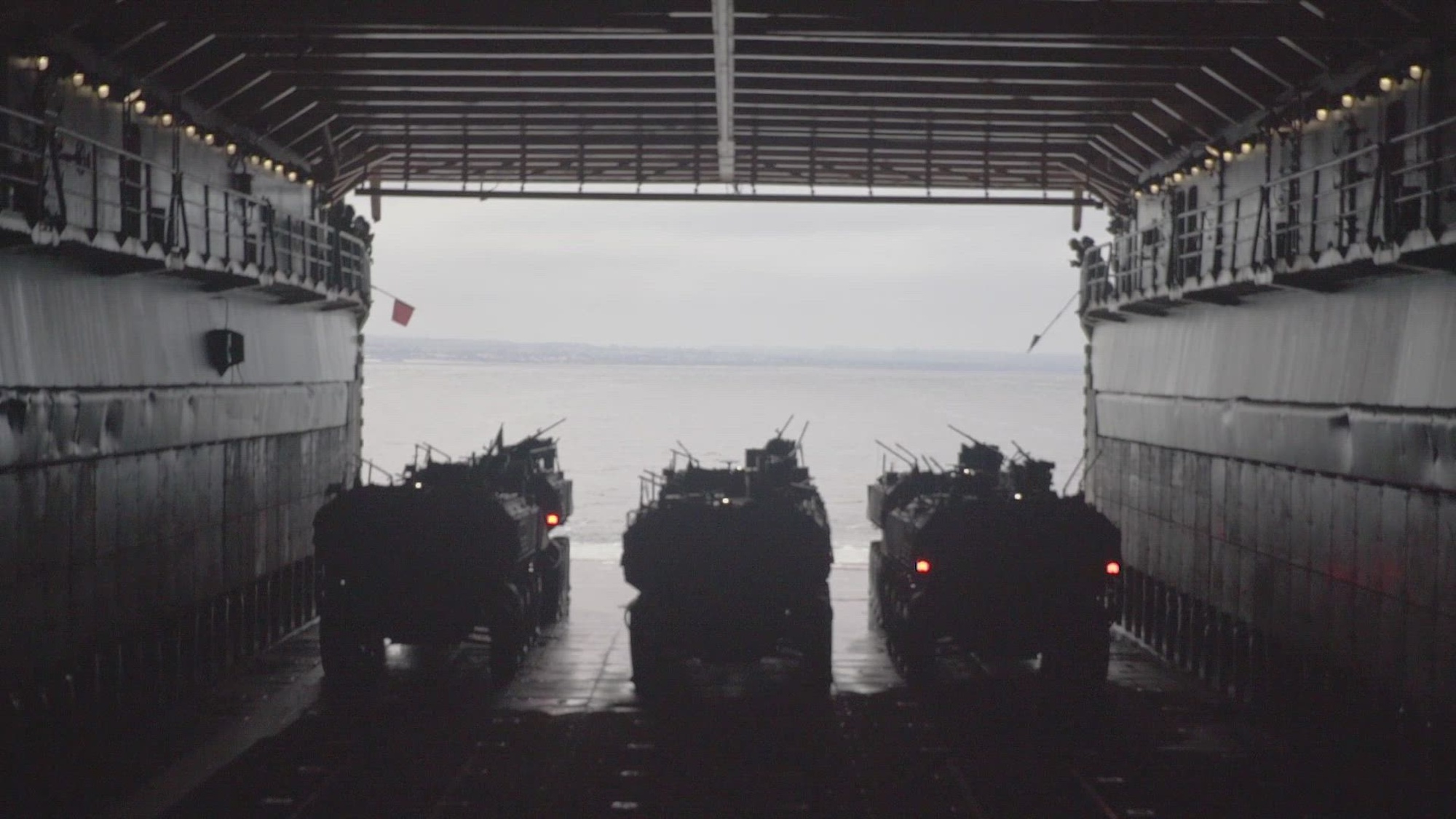U.S. Marine Corps amphibious combat vehicles attached to 3rd Assault Amphibious Battalion, 1st Marine Division, splash off the amphibious dock landing ship USS Harpers Ferry (LSD 49) for certification qualifications during Quarterly Underway Amphibious Readiness Training 25.3 while underway in the Pacific Ocean, May 29, 2025. QUART is a joint training exercise designed to develop and sustain essential amphibious readiness skills for effective operations in maritime environments while reinforcing the Navy-Marine Corps partnership. (U.S. Marine Corps video by Cpl. Luis Agostini)