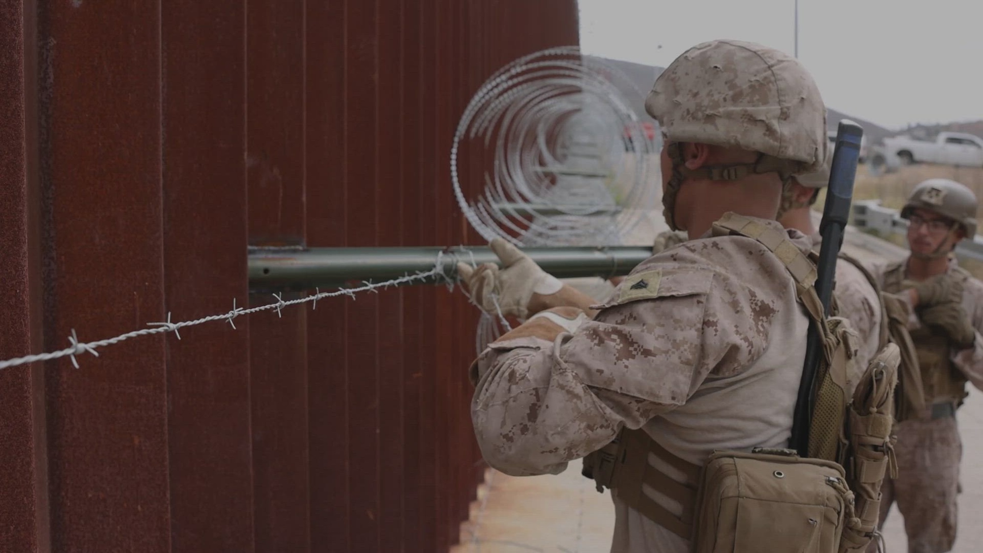 U.S. Marines, assigned to Task Force Sapper, repair a section of barbed wire along the southern border barrier near Otay Mesa, Calif., May 2, 2025. Task Force Sapper is composed of 500 Marines and sailors from I Marine Expeditionary Force who have been tasked with engineering support to U.S. Northern Command with the emplacement of physical barriers on the Southern Border barrier to add additional security that will curtail illegal border crossings. Under the direction of the U.S. NORTHCOM, Joint Task Force–Southern Border aligns efforts to seal the southern border and repel illegal activity and is responsible for full-scale, agile, and all-domain operations, which will allow for more effective and efficient DoD operations. (U.S. Marine Corps video by Lance Cpl. Nataly Espitia)