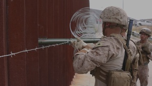U.S. Marines with Task Force Sapper repair section of southern barrier