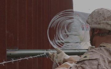U.S. Marines with Task Force Sapper repair section of southern barrier