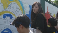 MARFORK Volunteers Join Children In Mural Painting - Capt. Schwien Interview