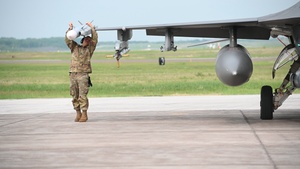 Aircraft Armament Systems Specialist inspects an F-16 Fighting Falcon