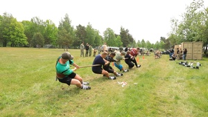 U.S. Navy and Latvian Sailors Compete in Tug of War
