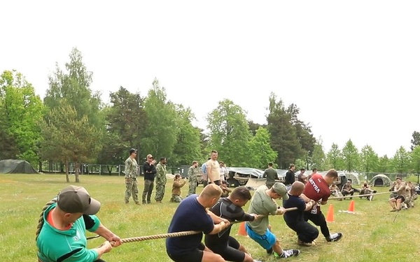 U.S. Navy and Latvian Sailors Compete in Tug of War