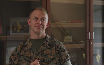 U.S. Marine Corps Gunnery Sergeant receives the Commanding General’s Cowbell Award for improvements to F-35 maintenance equipment