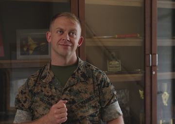 U.S. Marine Corps Gunnery Sergeant receives the Commanding General’s Cowbell Award for improvements to F-35 maintenance equipment