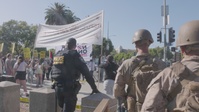 B-Roll: U.S. Marines, Department of Homeland Security police, FBI police guard federal building