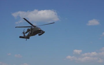 12CAB Soldiers conduct  simulated MEDEVAC hoist training with a UH-60 Black Hawk helicopter