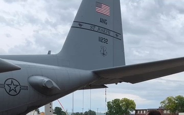 Crew chiefs change aircraft tire