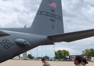 Crew chiefs change aircraft tire