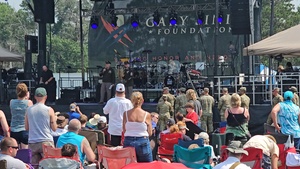 Fort McCoy senior commander, garrison CSM, welcome Lt. Dan Band to Fort McCoy for performance