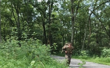 Competitors ruck and run in a Bosnia and Herzegovina soldier task lane - 2025 National Best Warrior