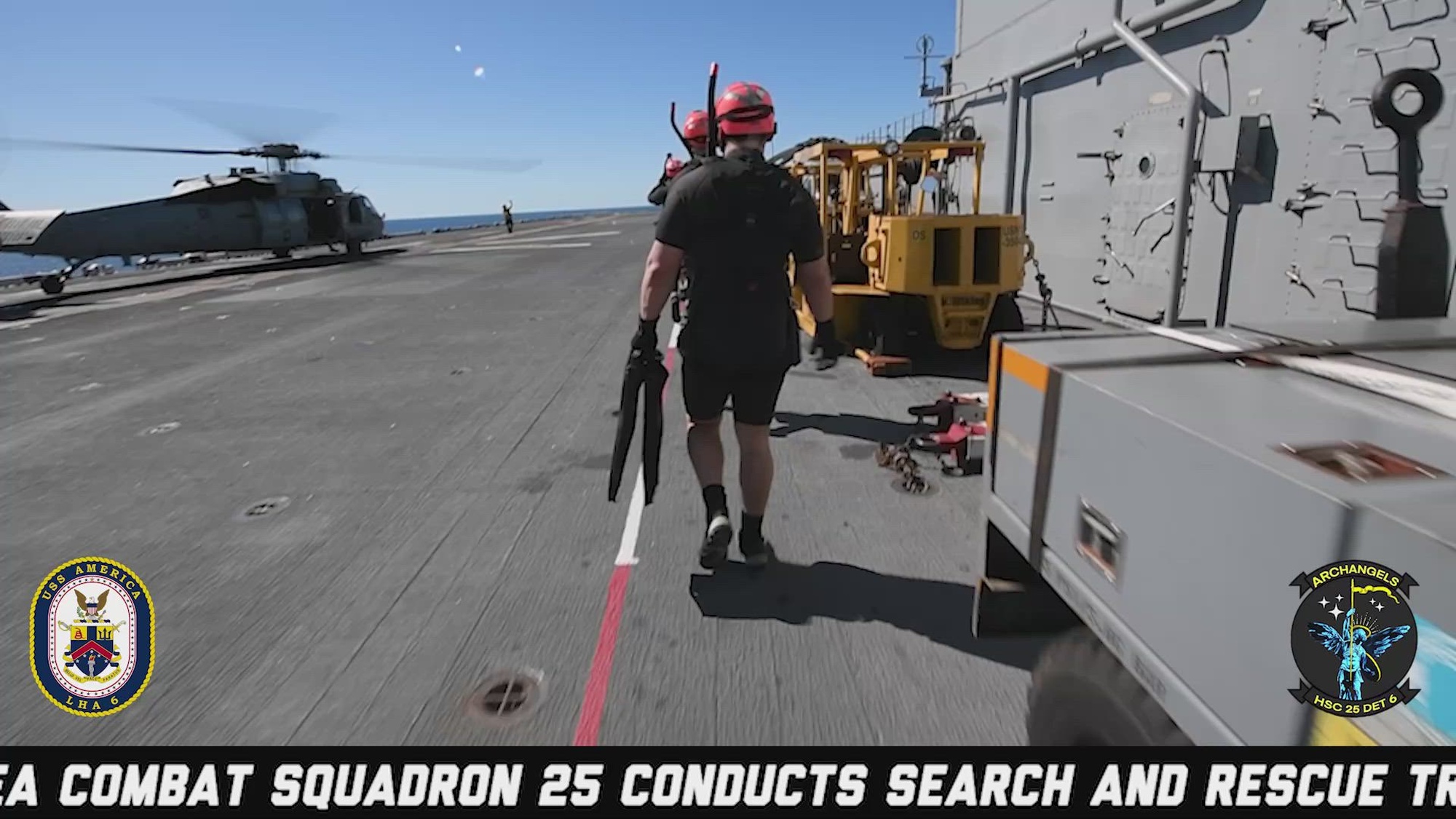 Sailors assigned to the forward-deployed amphibious assault ship USS America (LHA 6)  and Helicopter Sea Combat Squadron (HSC) 25 conduct search and rescue training in the Coral Sea during Talisman Sabre 25. (U.S. Navy video by Mass Communication Specialist 2nd Class Cole Pursley and Mass Communication Specialist 3rd Class Kenneth Melseth)