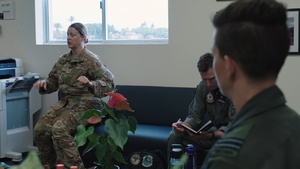 Members of the U.S. Air Force, Royal Australian Air Force and Royal New Zealand Air Force debrief aeromedical evacuation training