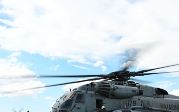 POL assists with Marine CH-53 Hot Pit