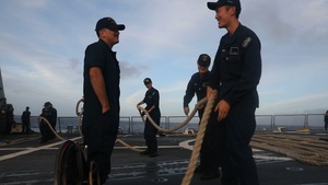 Sailors aboard the USS John Finn conduct a sea and anchor detail in Diego Garcia