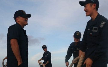 Sailors aboard the USS John Finn conduct a sea and anchor detail in Diego Garcia