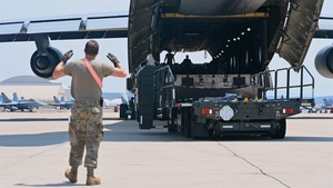 12th Air Task Force Airmen unload a C-5M Super Galaxy during exercise Bamboo Eagle 25-3 (B-Roll)