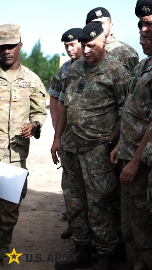 3rd Infantry Division Soldier Conducts Preventative Maintenance Checks and Services With Lithuanian Army (Reel)