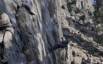 V35 and V11 Marines conduct mock lead climbing during Assault Climbers Course