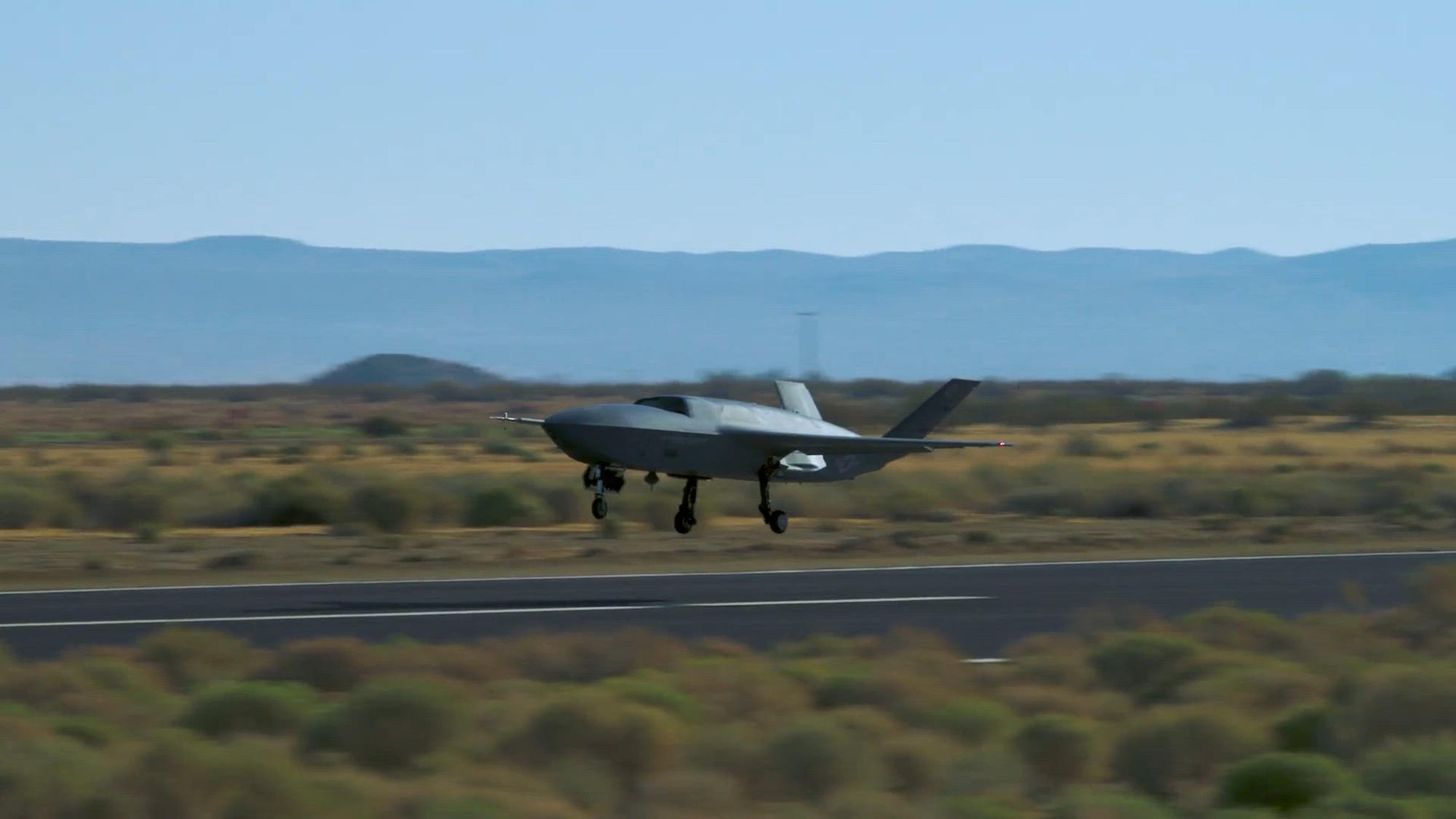 A YFQ-42A Collaborative Combat Aircraft, developed in partnership with General Atomics, conducts flight testing at a California test location. The Department of the Air Force is developing multiple prototype designs to evaluate airworthiness, flight autonomy and mission system integration for the CCA program. (Courtesy video)