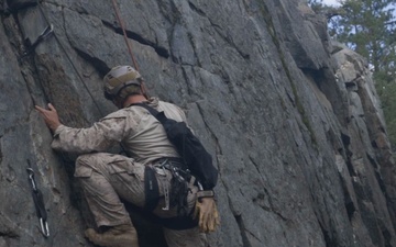 V35 and V11 Marines conduct lead climbing during Assault Climbers Course