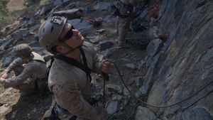 V35 and V11 Marines conduct lead climbing during Assault Climbers Course