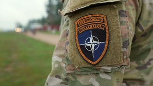 U.S. Soldiers stand with NATO allies on BPTA Day