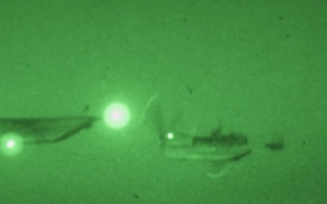U.S. Marine MV-22B Ospreys refuel at night off the coast of Kagoshima, Japan