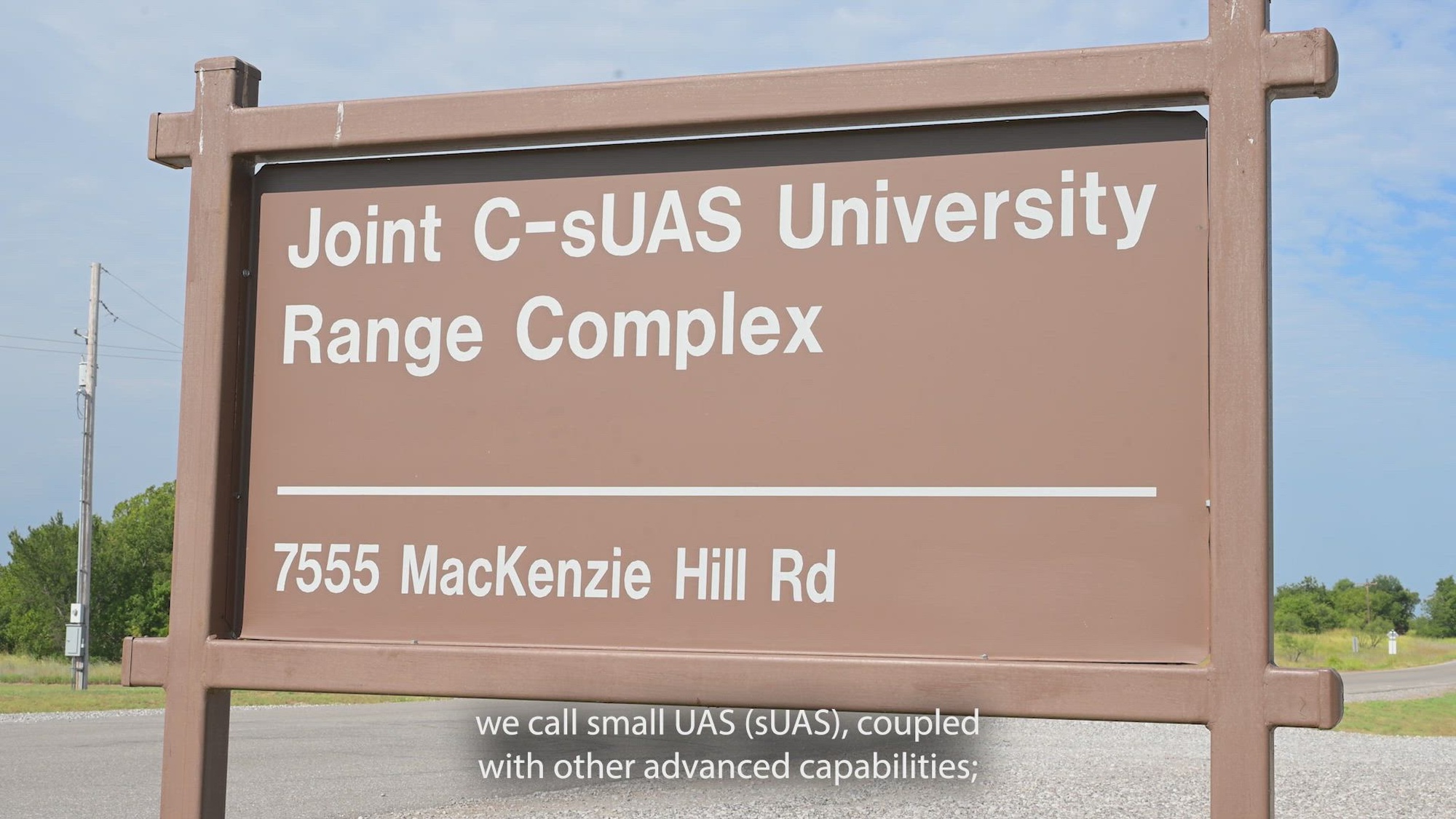 A brown signs that reads: Joint C-sUAS University Range Complex