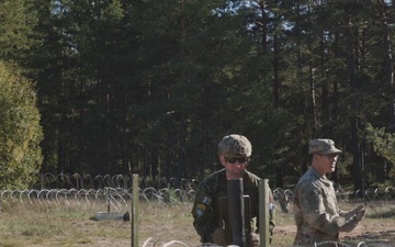 U.S. Military Police construct containment centers with their NATO allies