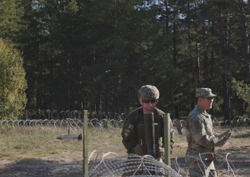 U.S. Military Police construct containment centers with their NATO allies