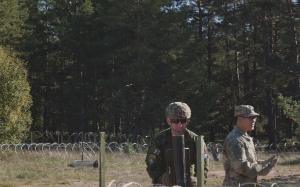 U.S. Military Police construct containment centers with their NATO allies