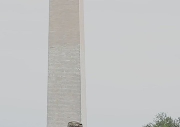 U.S. Air Force Tech. Sgt. Richard Kramer and Airman Devontae Taylor assist a lost child near the Washington Monument in Washington, D.C.